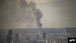 Smoke rises from the city of Sievierodonetsk in the eastern Ukrainian region of Donbas on June 13, 2022. 