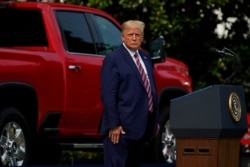 President Donald Trump pauses as he speaks during an event on the South Lawn of the White House, July 16, 2020, in Washington.