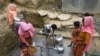 Rohingya refugees collect drinking water at the Shalbagan refugee camp in Teknaf, Bangladesh, March 5, 2019. 