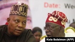 Mgombea urais wa chama tawala cha All Progresive Congress APC, Bola Ahmed Tinubu (kushoto) akiwa na Kashim Shettima Julai 20, 2022. (Picha na Kola Sulaimon / AFP)
