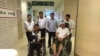 Cambodian opposition​ CNRP lawmakers Nhay Chamroeun and Kong Saphea are seen in wheelchairs at Phyathai hospital in Bangkok on Tuesday, October 27, 2015 after being beaten by protesters in Phnom Penh, Cambodia on Monday. (Courtesy of Nhay Chamroeun)