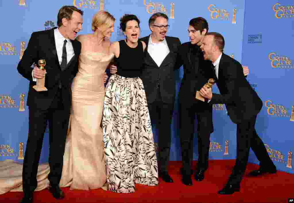From left, Bryan Cranston, Anna Gunn, Betsy Brandt, Vince Gilligan, RJ Mitte, and Aaron Paul pose in the press room with the award for Best TV Series - Drama for "Breaking Bad" at the 71st annual Golden Globe Awards at the Beverly Hilton Hotel, California, Jan. 12, 2014.