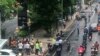 A crowd gathers near the site where explosions were heard in Bangkok, Thailand, Aug. 2, 2019, in this image obtained via social media. (Twitter/@YRNMXSK)