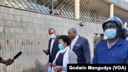 Lawyer Beatrice Mtetwa with Job Sikhala and Hopewell Chin'ono 