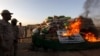 A soldier torches a pile of narcotics during a joint destruction ceremony by the Anti Narcotics Force (ANF) and Pakistan Coast Guards (PCG) on the outskirts of Karachi, Oct. 15, 2015.