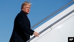 President Donald Trump boards Air Force One for a trip to Cincinnati to promote his tax policy, Feb. 5, 2018, in Andrews Air Force Base, Maryland.