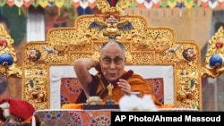Tibetan spiritual leader the Dalai Lama addresses devotees on the first day of Kalachakra in Bodhgaya, India, Jan. 2, 2017.