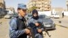 FILE - An image grab taken from a video from AFPTV, on Feb. 6, 2019, shows forces loyal to Libyan strongman Khalifa Haftar patrolling in downtown Sebha, the biggest city in southern Libya. 