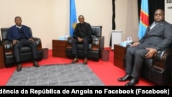 Presidentes João Lourenço, de Angola (esq), Paul Kagame, do Ruanda (cen) e Felix Tshisekedi, da RDC, Luanda, 21 Fevereiro 2020