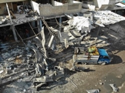 An aerial view shows the destruction following a regime airstrike in a market in the town of Maaret al-Numan in the jihadist-run Syrian province of Idlib, Dec. 2, 2019.