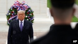 President Donald Trump participates in a Veterans Day wreath laying ceremony at the Tomb of the Unknown Soldier at Arlington National Cemetery in Arlington, Va., Wednesday, Nov. 11, 2020. (AP Photo/Patrick Semansky)