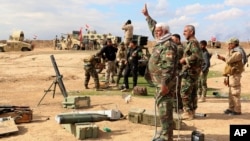 Pasukan Irak dan milisi Syiah mempersiapkan serangan di pinggiran kota Tikrit (4/3).