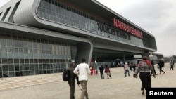 FILE - Passengers arrive to purchase tickets for the Standard Gauge Railway (SGR) line constructed by the China Road and Bridge Corporation (CRBC) and financed by Chinese government at the Nairobi Terminus in Nairobi, Kenya, July 28, 2017. 