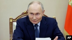 FILE - Russian President Vladimir Putin speaks during a meeting at the Kremlin in Moscow, Russia, Nov. 22, 2024. Putin has made "traditional family values" a cornerstone of his 25 years of power.