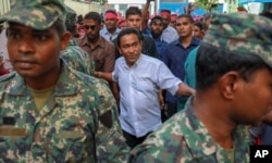 FILE - Maldivian President Abdulla Yameen, center, surrounded by his body guards arrives to address his supporters in Male, Feb. 3, 2018.