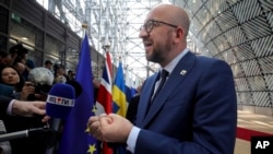 Belgian Prime Minister Charles Michel speaks with reporters as he arrives for an EU summit in Brussels, April 29, 2017. 