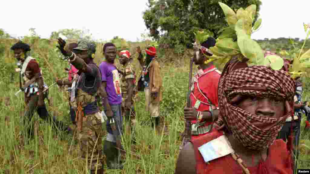 Members of the anti-balaka, a Christian militia, patrol outside the village of Zawa, Central African Republic, April 8, 2014.