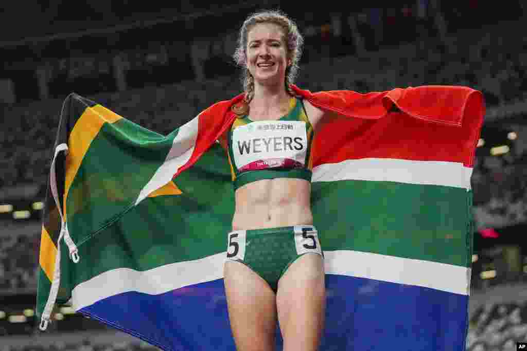 South Africa's Anrune Weyers celebrates after winning the women's T47 400-meters final during the 2020 Paralympics at the National Stadium in Tokyo. (AP Photo/Eugene Hoshiko)