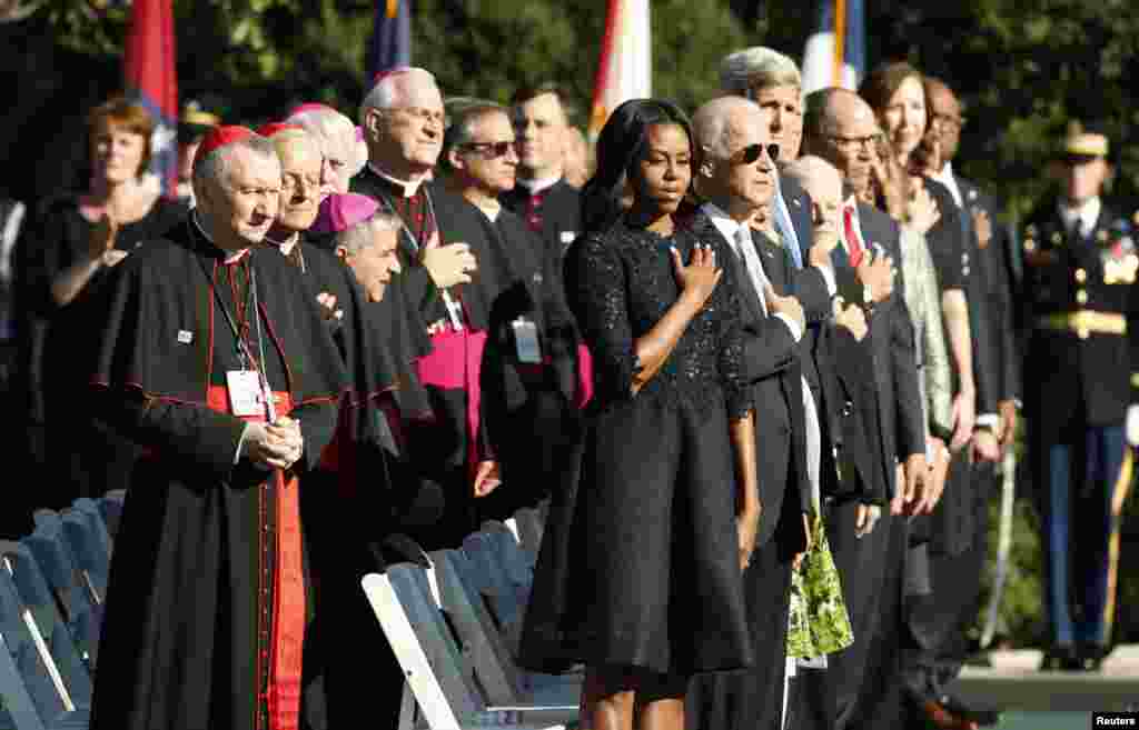 U.S. first lady Michelle Obama stands with U.S. bishops and members of President Barack Obama's Cabinet during an arrival ceremony for Pope Francis at the White House, Sept. 23, 2015.
