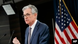 Federal Reserve Chair Jerome Powell speaks during a news conference, Tuesday, March 3, 2020, to discuss an announcement from the Federal Open Market Committee, in Washington. In a surprise move, the Federal Reserve cut its benchmark interest rate by…