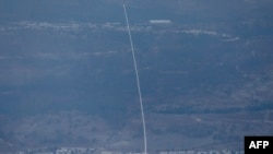 An rocket from Israel's Iron Dome air defence system is fired to intercept rockets fired from southern Lebanon over the Upper Galilee region in northern Israel on September 22, 2024.