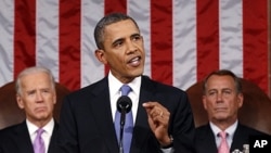 President Barack Obama delivers a speech to a joint session of Congress at the Capitol in Washington. Watching are Vice President Joe Biden and House Speaker John Boehner, September 8, 2011