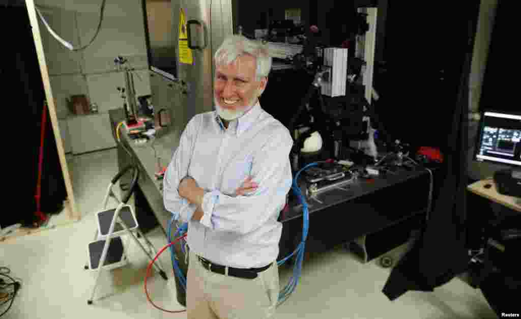 Professor John O'Keefe, one of three winers of the 2014 Nobel Prize for medicine, poses in his laboratory at University College London, in London, England, Oct. 6, 2014.