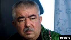 FILE - Abdul Rashid Dostum, who now is Afghanistan's first vice president, speaks during an interview with Reuters in Shibergan, in northern Afghanistan, Aug. 19, 2009. 