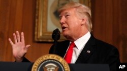 President Donald Trump speaks at the Interior Department in Washington, April, 26, 2017. Trump signed an executive order Wednesday directing his interior secretary to review the designation of dozens of national monuments on federal lands.