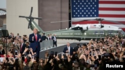 FILE - U.S. President Donald Trump visits U.S. troops based in Osan Air Base, South Korea June 30, 2019. 