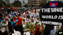 Protesters gather to call for the release of 21 detainees in Phnom Penh, Cambodia, Monday, March 3, 2014.
