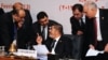 Egyptian President Mohamed Morsi (C) chatting with officials during the closing session of the 12th summit of the Organization of Islamic Cooperation (OIC) in Cairo, February 7, 2013.