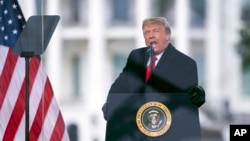 FILE - Then-President Donald Trump speaks during a rally protesting the electoral college certification of Joe Biden as President in Washington, Jan. 6, 2021. 