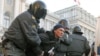 Russian police detain a participant during an opposition rally protesting Vladimir Putin's presidential victory, in St. Petersburg, March 5, 2012. 