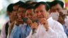 Cambodian Vice President of the National Assembly Kem Sokha, also vice president of Cambodia National Rescue Party, foreground, delivers a speech during a Buddhist ceremony to mark 18th anniversary in Phnom Penh, Cambodia, Monday, March 30, 2015.