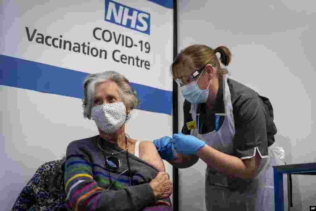 Dr Doreen Brown, 85, receives the first of two Pfizer/BioNTech COVID-19 vaccine jabs administered at Guy's Hospital in London, Dec. 8, 2020.