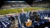 Para penggemar klub sepak bola Amerika, BYU, membuat poster gambar capres Demokrat Joe Biden dan petahana Presiden Donald Trump sebelum laga antara BYU dan Western Kentucky, di Provo, Utah, Sabtu, 31 Oktober 2020.
