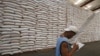 A National Food Authority (NFA) worker makes an inventory of rice stocks at a government rice warehouse in Taguig, Metro Manila, March 11, 2014.