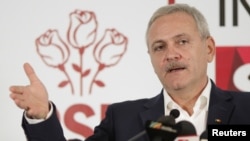 FILE - Leader of Romania's leftist Social Democrat Party (PSD), Liviu Dragnea, gestures during a press conference following the end of the parliamentary elections, in Bucharest, Romania, Dec. 11, 2016.