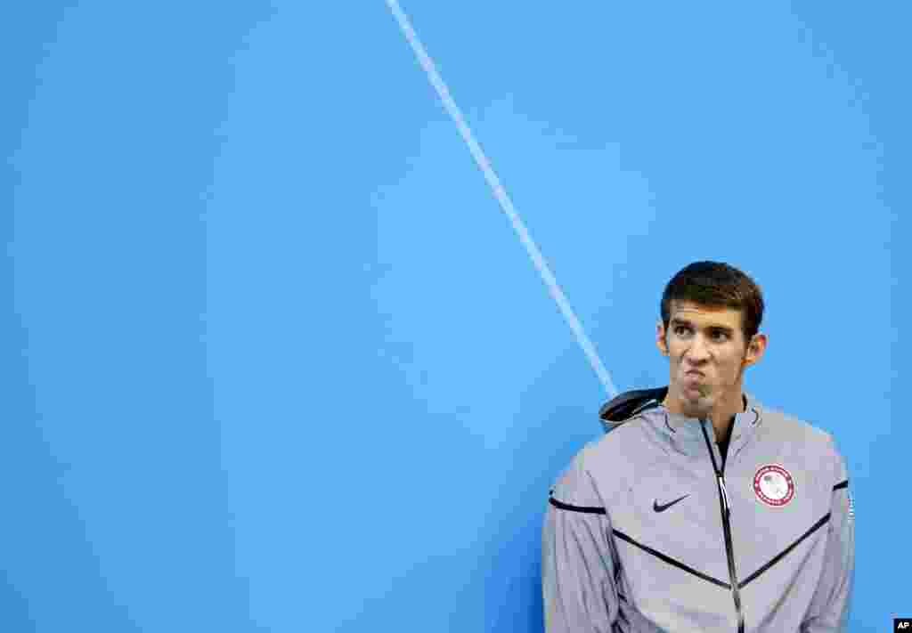 Michael Phelps waits to receive his silver medal for the men's 200-meter butterfly swimming final at the Aquatics Centre in the Olympic Park during the 2012 Summer Olympics in London, July 31, 2012.