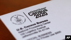 FILE - An envelope contains a 2020 census letter mailed to a US resident in Detroit, Michigan, April 5, 2020.