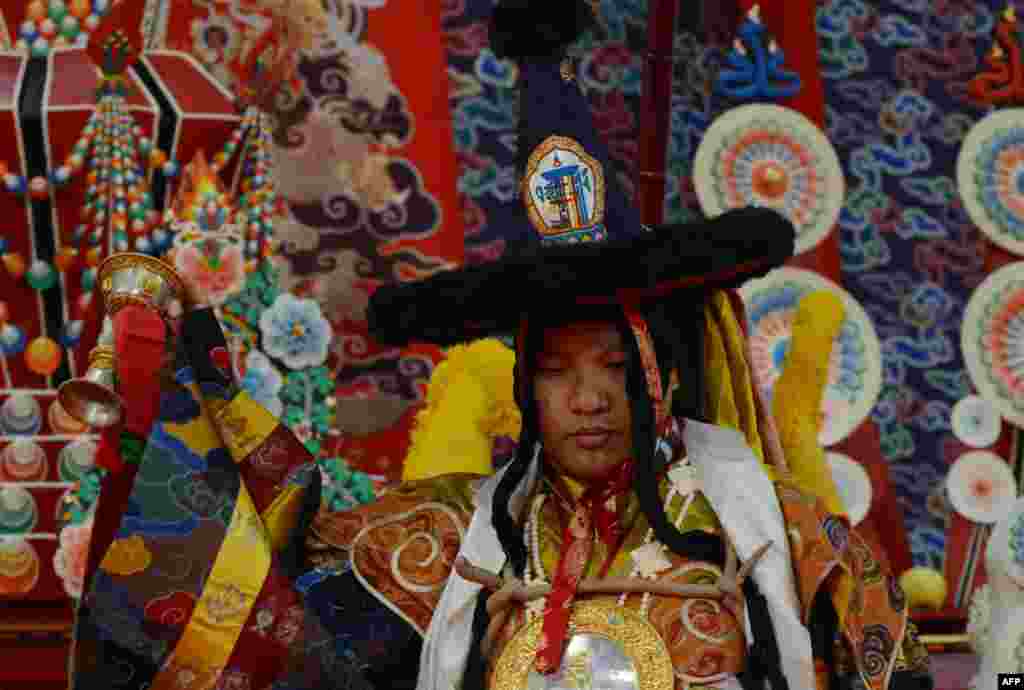 Tibet's third holiest man, the 17th Gyalwang Karmapa Ogyen Trinley Dorjee, performs a Vajra dance during the 31st Kagyu Monlam for World Peace in Bodhgaya. The Kagyu Monlam is an annual prayer festival in Bodhgaya.