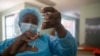 A nurse prepares to vaccinate a citizen against COVID-19, at Wilkins Hospital, Zimbabwe's main vaccination center, in Harare, May 12, 2021. (Columbus Mavhunga/VOA)