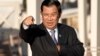 Cambodia's Prime Minister Hun Sen gestures as he arrives for a group photo of leaders at the 11th Asia-Europe Meeting (ASEM) in Ulaanbaatar, Mongolia, Saturday, July 16, 2016. (AP Photo/Mark Schiefelbein)
