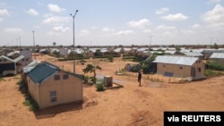 FILE - A man walks along a path in the Hamdallaye refugee camp amid the COVID-19 pandemic in Niger, July 29, 2020. (UNHCR/Selim Meddeb/Handout via Reuters) 