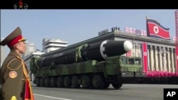 FILE - In this image made from video by North Korea's KRT, a military parade is held in Pyongyang, North Korea, Feb. 8, 2018, showcasing the country's intercontinental ballistic missiles.