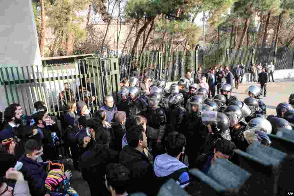 Iranian students scuffle with police at the University of Tehran during a demonstration driven by anger over economic problems, in the capital Tehran, Iran, Dec. 30, 2017.