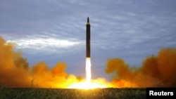 A missile is launched during a long and medium-range ballistic rocket launch drill in this undated photo released by North Korea's Korean Central News Agency in Pyongyang on Aug. 30, 2017.
