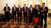 Members of the United States delegation wait outside a room where a meeting between U.S. Secretary of State John Kerry and Iranian Foreign Minister Javad Zarif, is being held at the Palais Coburg hotel in Vienna, Austria, June 28, 2015. 
