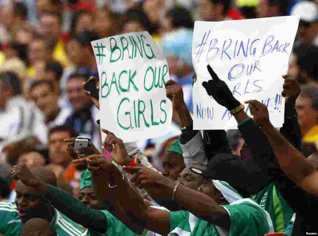 Fans of Nigeria hold up signs referring to the Boko Haram kidnapping during their 2014 World Cup Group F soccer match against Argentina at Beira Rio stadium in Porto Alegre, Brazil.